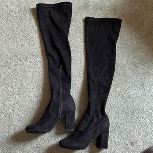 Knee high black heeled boots